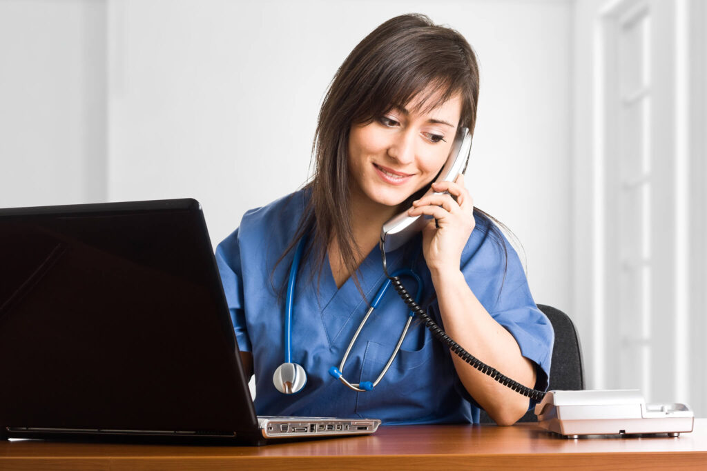 Front desk staff welcoming a patient at Arise Family Medicine in Denton, TX