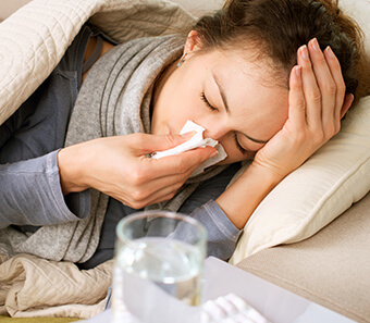 Provider examining a sick patient during a same-week appointment