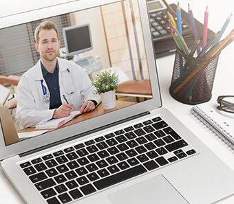 Patient talking with their doctor on a telehealth video visit from home